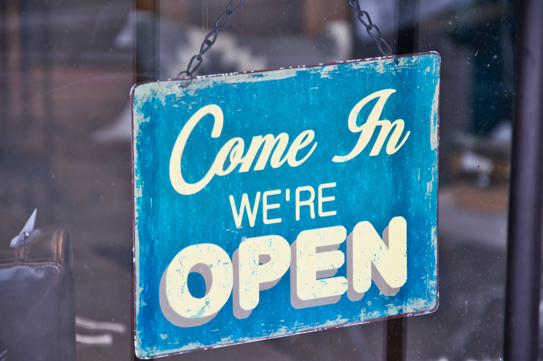 blue and white come in we re open signboard computer shop open Saturday