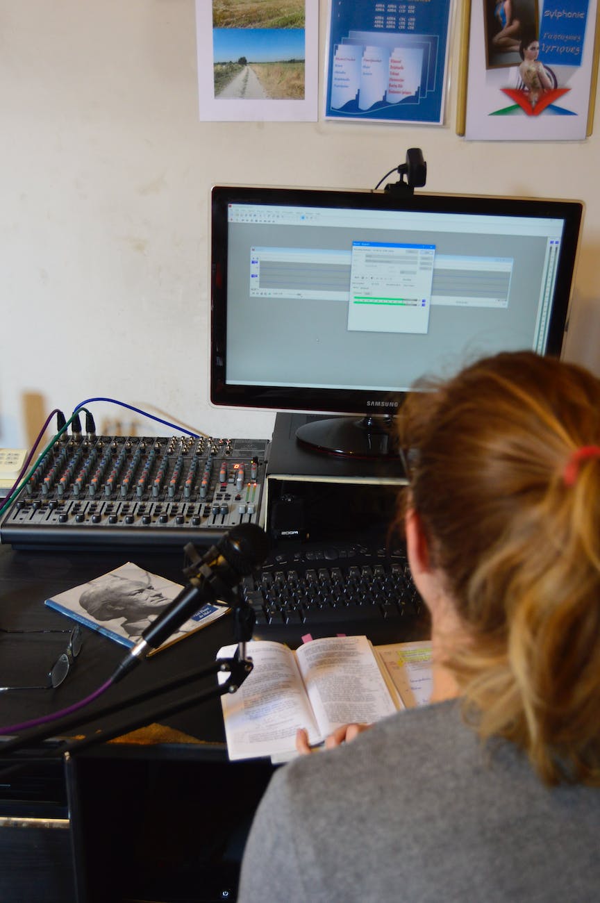 unrecognizable sound engineer installing software on desktop computer at home